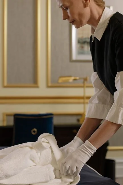 a-person-in-white-gloves-is-cleaning-a-chair-wnudjlnuohu