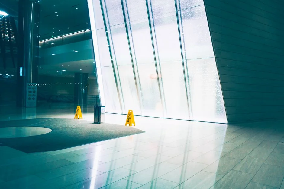 Cleaner cleaning the floor in a laboratory environment